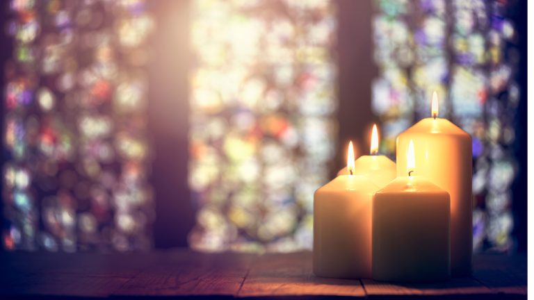 candles and stained glass cropped shutterstock 1570103068 768x432